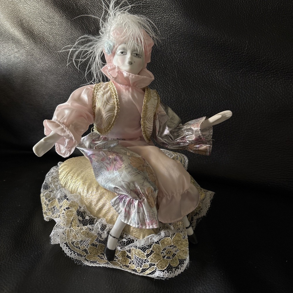 Vintage Porcelain Clown Jester Music Box Sitting on Gold Pillow 8 Inch Poseable